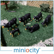 MCY076-509 MINIOCITY Black cows in assorted poses - pack of 6