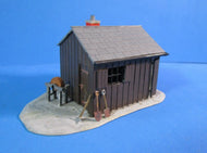 UB058 Workman's hut with grinding wheel